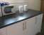 Kitchen - microwave, kettles and cupboards